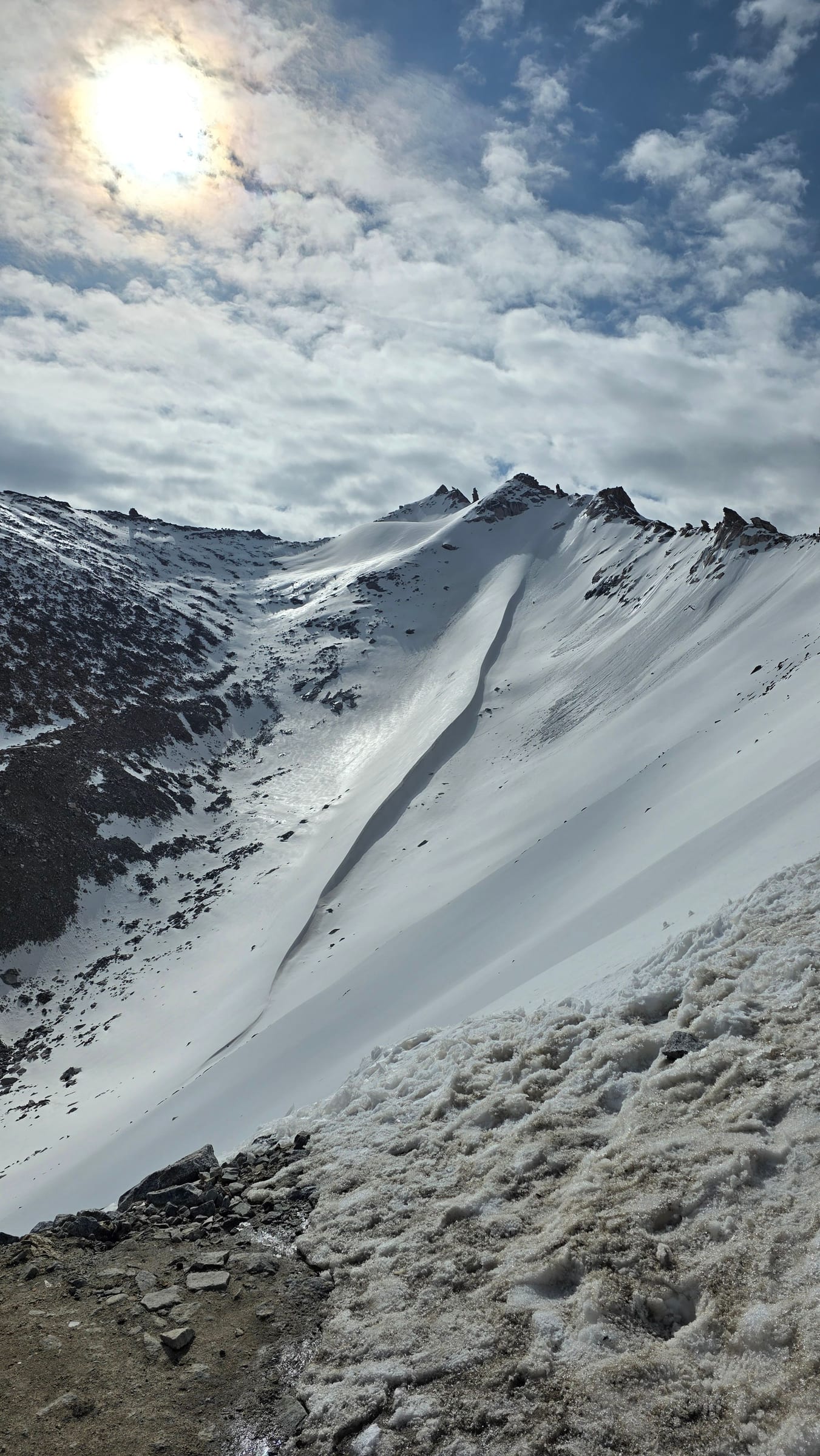Snow-covered slopes near the top of Khardung La