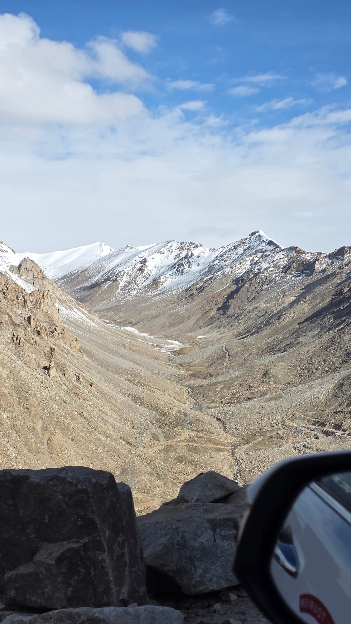 Snow peaks and a high valley on the Khardung La crossing