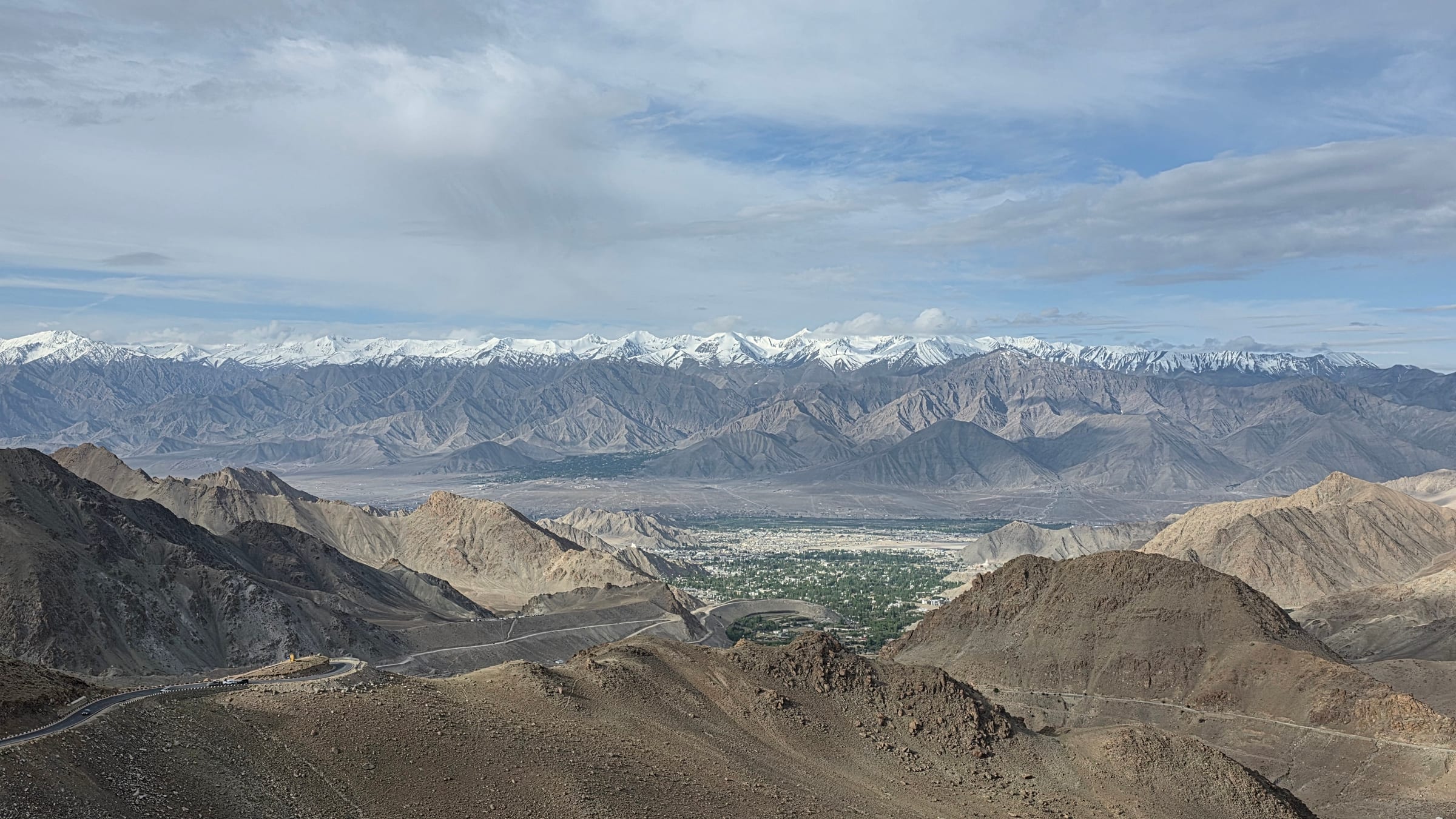 A mountain road winding through the Leh valley