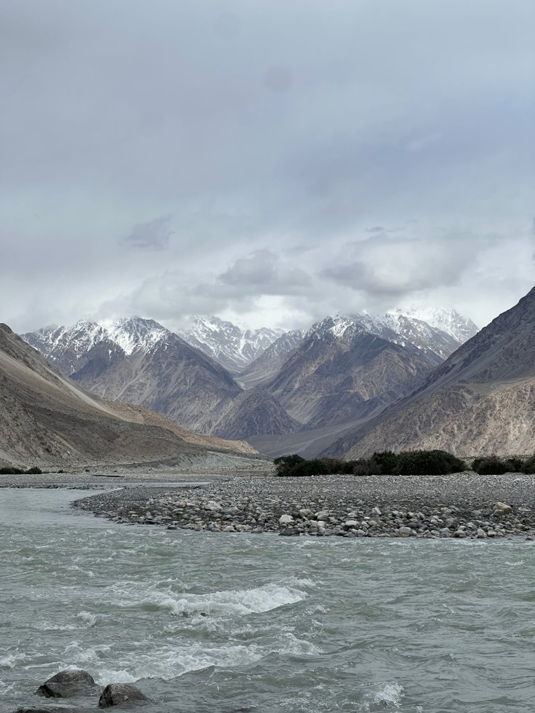 The Shyok river, stony banks and snow peaks near Hunder