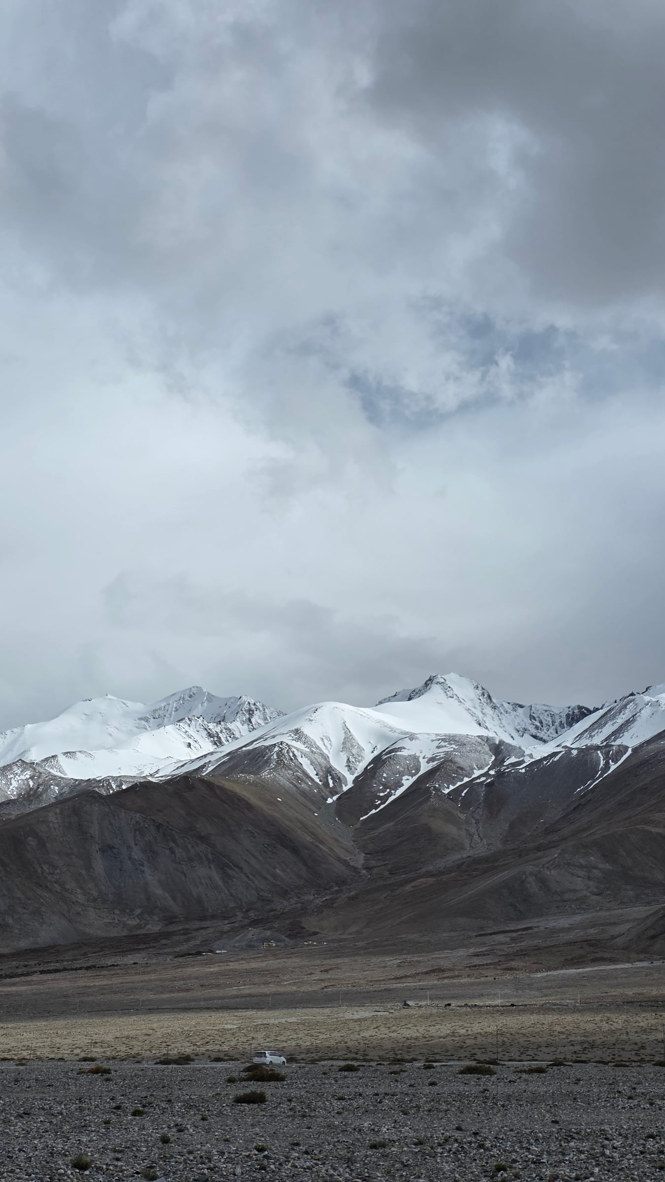 The high road toward Pangong Tso under cloud and mountain