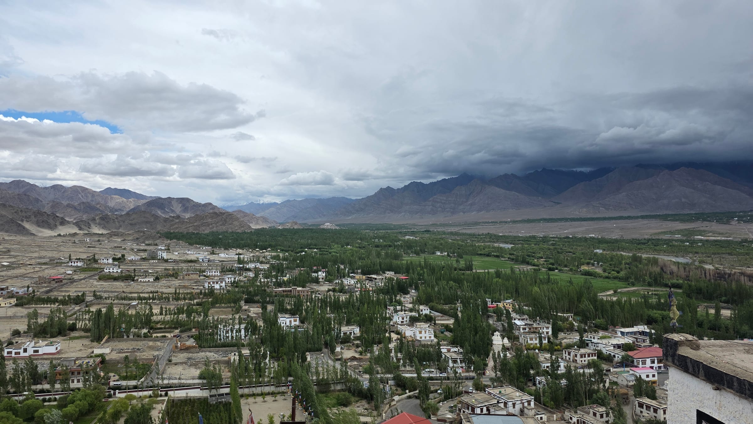 Storm clouds over a green valley