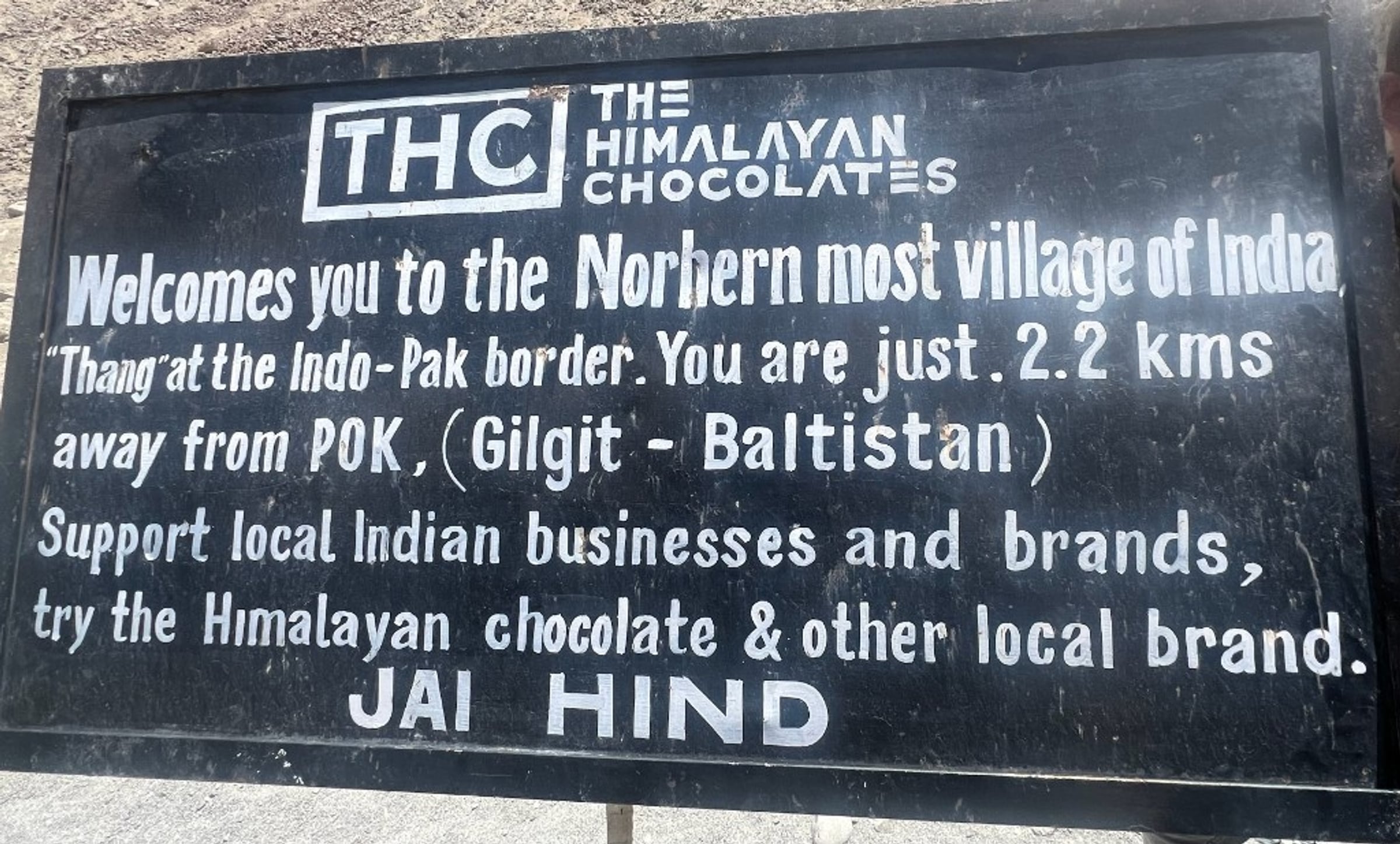 A sign at Thang noting you are about 2.2 km from PoK